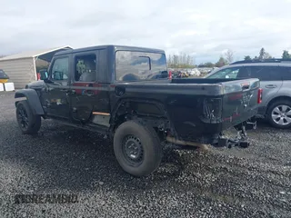 2023 Jeep Gladiator High Altitude z VIN 1C6HJTFG0PL504618, wystawiony jako IAAI lot #41877983 z przebiegiem 26 402 mil mil oraz . Historia ofert i sprzedaży dostępna na DreamBid. Obrazek 3.