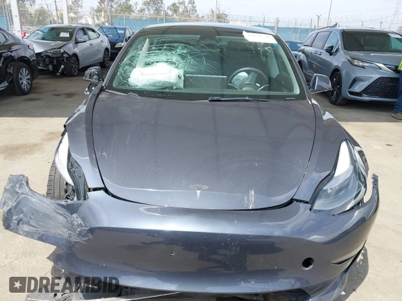 2023 Tesla Model 3 with VIN 5YJ3E1EA0PF518904, listed as a IAAI auction lot 42058540 with 20,945 mi miles and . Bid and sale history available at DreamBid. Image 11.