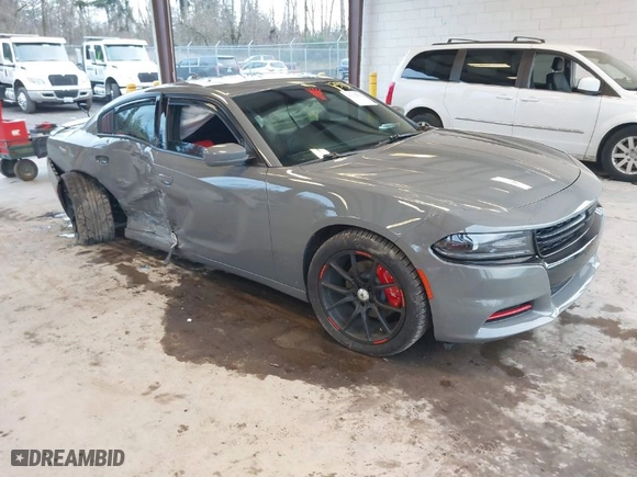 2019 Dodge Charger SXT with VIN 2C3CDXJG2KH547683, listed as a IAAI auction lot 41232974 with 75,960 mi miles. Bid and sale history available at carsss.com. Image 1.