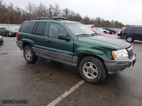 1999 Jeep Grand Cherokee Laredo with VIN 1J4GW58N0XC684111, listed as a Copart auction lot 85944784 with 128,741 mi miles and Salvage Title. Bid and sale history available at carsss.com. Image 4.