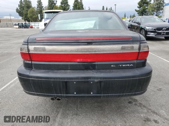 1997 Cadillac Catera z VIN W06VR52RXVR092016, wystawiony jako Copart lot #54067575 z przebiegiem 63 978 mil mil oraz Tytuł czysty. Historia ofert i sprzedaży dostępna na DreamBid. Obrazek 6.