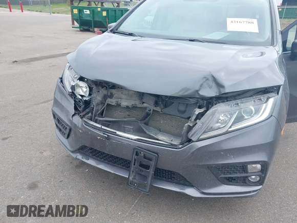 2018 Honda Odyssey EX-L z VIN 5FNRL6H72JB090127, wystawiony jako IAAI lot #42167788 z przebiegiem 114 984 mil mil oraz . Historia ofert i sprzedaży dostępna na DreamBid. Obrazek 6.