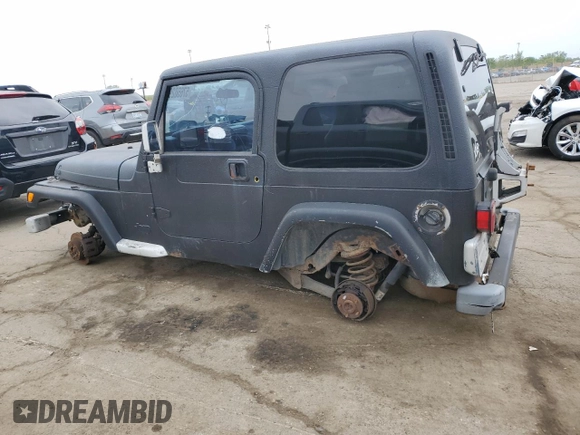 2002 Jeep Wrangler Sport z VIN 1J4FA49S22P763189, wystawiony jako Copart lot #57650295 z przebiegiem 197 383 mil mil oraz Czysty tytuł • Clean title. Historia ofert i sprzedaży dostępna na DreamBid. Obrazek 2.