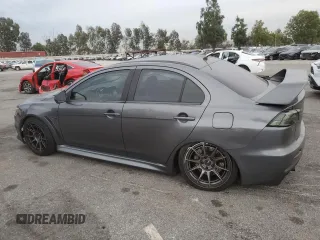 2010 Mitsubishi Lancer Evolution GSR with VIN JA32W8FV1AU027600, listed as a Copart auction lot 84328974 with 88,417 mi miles and Salvage Title. Bid and sale history available at DreamBid. Image 2.