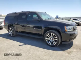 2014 Chevrolet Suburban LS with VIN 1GNSCHE03ER132039, listed as a Copart auction lot 68390234 with 129,744 mi miles and Salvage Title. Bid and sale history available at carsss.com. Image 4.