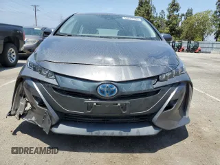 2021 Toyota Prius LE z VIN JTDKAMFPXM3174518, wystawiony jako Copart lot #58854495 z przebiegiem 83 445 mil mil oraz Szkoda całkowita • Salvage title. Historia ofert i sprzedaży dostępna na DreamBid. Obrazek 5.