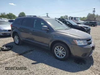 2015 Dodge Journey SXT with VIN 3C4PDDBG8FT715799, listed as a Copart auction lot 61681915 with 128,164 mi miles and Clean title. Bid and sale history available at DreamBid. Image 4.