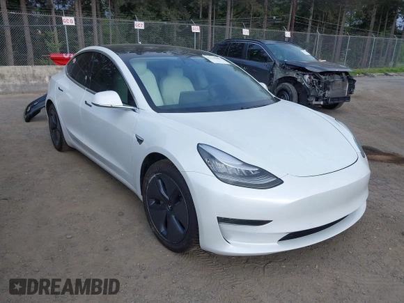 2020 Tesla Model 3 Standard Range Plus with VIN 5YJ3E1EA5LF613002, listed as a IAAI auction lot 42129085 with 55,672 mi miles. Bid and sale history available at carsss.com. Image 1.