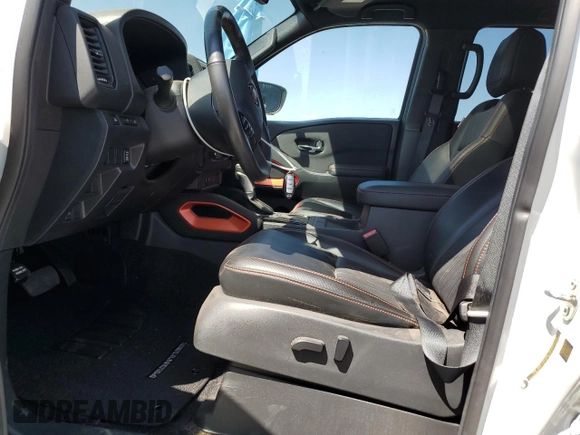 2023 Nissan Frontier SV with VIN 1N6ED1EJ3PN670640, listed as a Copart auction lot 58039525 with 15,302 mi miles and Salvage title. Bid and sale history available at DreamBid. Image 7.