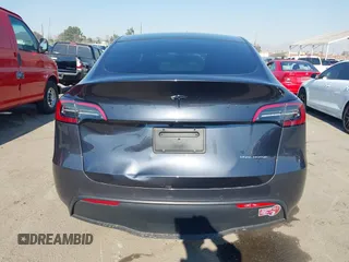 2022 Tesla Model Y Long Range z VIN 7SAYGDEE4NF522698, wystawiony jako IAAI lot #41287885 z przebiegiem 82 306 mil mil oraz . Historia ofert i sprzedaży dostępna na DreamBid. Obrazek 16.