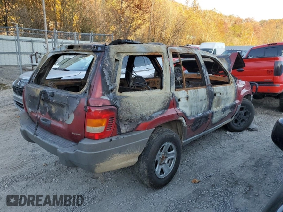 2002 Jeep Grand Cherokee z VIN 1J8GW38S72C159886, wystawiony jako Copart lot #77765704 z przebiegiem Nie podano mil oraz Szkoda całkowita • Salvage title. Historia ofert i sprzedaży dostępna na DreamBid. Obrazek 3.