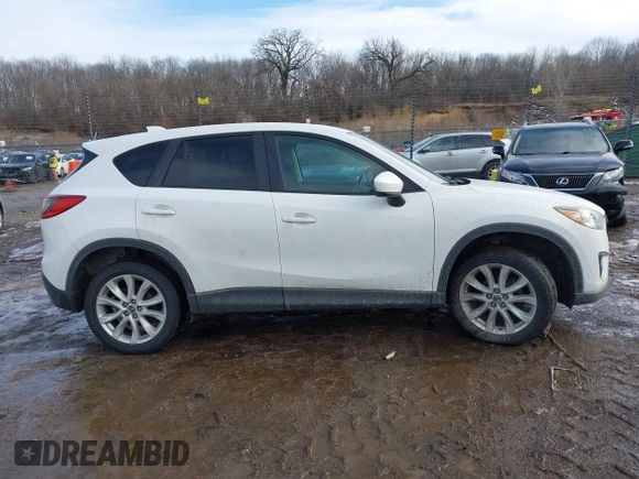 2014 Mazda CX-5 Grand Touring with VIN JM3KE4DY9E0300491, listed as a IAAI auction lot 41657153 with 157,394 mi miles and . Bid and sale history available at DreamBid. Image 13.