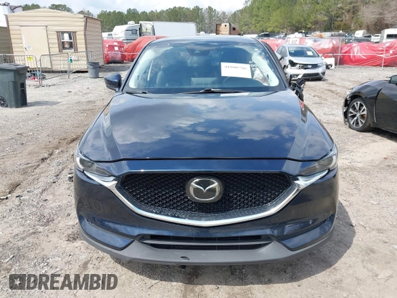 2021 Mazda CX-5 Grand Touring with VIN JM3KFBDM8M0484383, listed as a IAAI auction lot 41800786 with 58,617 mi miles. Bid and sale history available at carsss.com. Image 12.