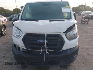 2020 Ford Transit Cargo with VIN 1FTBR1Y80LKB45384, listed as a IAAI auction lot 41479703 with 63,232 mi miles and . Bid and sale history available at DreamBid. Image 6.