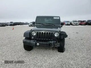 2017 Jeep Wrangler Willys Wheeler with VIN 1C4AJWAG9HL696710, listed as a Copart auction lot 88744905 with 66,800 mi miles and Salvage Title. Bid and sale history available at DreamBid. Image 10.