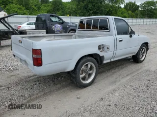 1989 Toyota Pickup DX z VIN JT4RN81PXK0034338, wystawiony jako Copart lot #58797935 z przebiegiem 210 495 mil mil oraz Tytuł czysty. Historia ofert i sprzedaży dostępna na DreamBid. Obrazek 3.