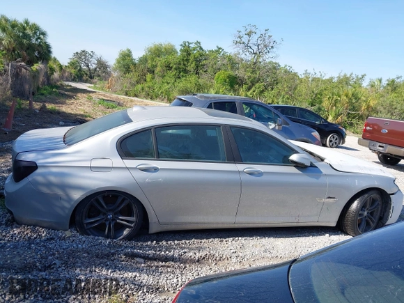 2013 BMW 7 Series 750Li with VIN WBAYE8C50DD133041, listed as a IAAI auction lot 42280002 with Not provided miles and . Bid and sale history available at DreamBid. Image 14.