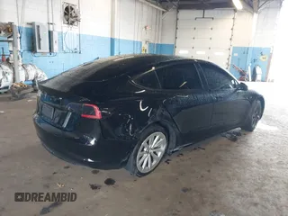 2023 Tesla Model 3 with VIN 5YJ3E1EA5PF396413, listed as a IAAI auction lot 42188639 with 57,717 mi miles and . Bid and sale history available at DreamBid. Image 4.