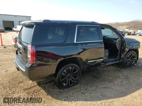 2016 GMC Yukon Denali with VIN 1GKS2CKJ9GR301628, listed as a Copart auction lot 48937035 with 121,863 mi miles and Salvage Title. Bid and sale history available at carsss.com. Image 15.