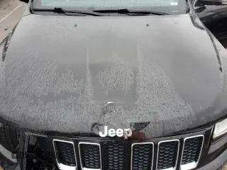 2015 Jeep Grand Cherokee Overland with VIN 1C4RJFCG7FC925995, listed as a Copart auction lot 85421214 with 142,266 mi miles and Salvage Title. Bid and sale history available at carsss.com. Image 12.