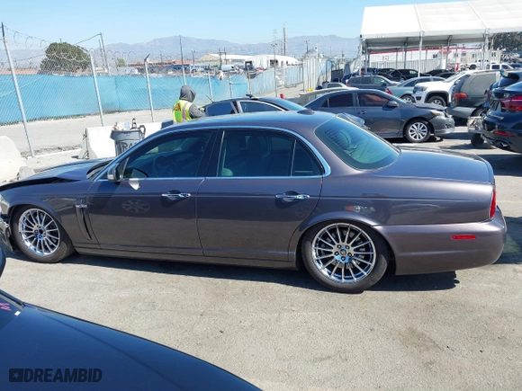 2008 Jaguar XJ with VIN SAJWA71B68SH22853, listed as a IAAI auction lot 41678688 with 76,367 mi miles. Bid and sale history available at carsss.com. Image 14.