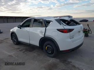 2019 Mazda CX-5 Sport with VIN JM3KFABMXK1655302, listed as a IAAI auction lot 41901293 with 140,369 mi miles and . Bid and sale history available at DreamBid. Image 3.