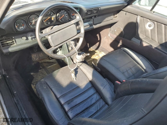 1986 Porsche 911 with VIN WP0EB0917GS161455, listed as a Copart auction lot 74672764 with 80,076 mi miles and Salvage Title. Bid and sale history available at carsss.com. Image 8.