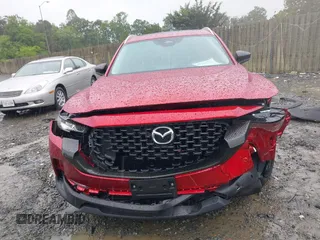 2025 Mazda CX-50 S Premium z VIN 7MMVABDM0SN316774, wystawiony jako IAAI lot #42248268 z przebiegiem 1634 mil mil oraz . Historia ofert i sprzedaży dostępna na DreamBid. Obrazek 13.