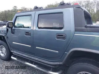2005 Hummer H2 SUT with VIN 5GRGN22U15H114401, listed as a IAAI auction lot 41268764 with 166,651 mi miles. Bid and sale history available at carsss.com. Image 14.