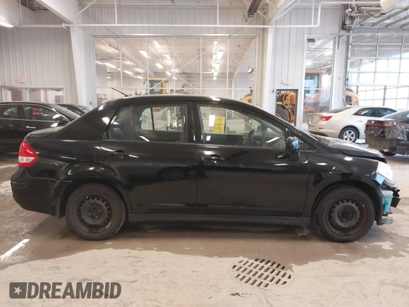 2009 Nissan Versa 1.8 S with VIN 3N1BC11E99L438342, listed as a IAAI auction lot 41561812 with 152,141 mi miles. Bid and sale history available at carsss.com. Image 14.