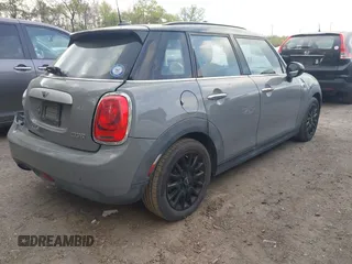2015 MINI Hardtop 4 Door with VIN WMWXS5C57FT831660, listed as a IAAI auction lot 42057682 with 110,940 mi miles and . Bid and sale history available at DreamBid. Image 4.