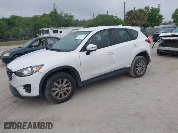 2016 Mazda CX-5 Sport with VIN JM3KE2BY1G0875484, listed as a IAAI auction lot 41838122 with 166,986 mi miles. Bid and sale history available at carsss.com. Image 2.