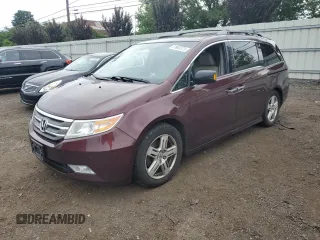 2013 Honda Odyssey Touring with VIN 5FNRL5H96DB014152, listed as a Copart auction lot 61694375 with Not provided miles and Salvage title. Bid and sale history available at DreamBid. Image 1.
