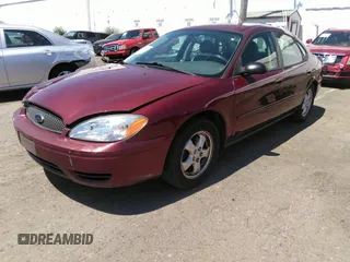 2005 Ford Taurus SE with VIN 1FAFP53U85A129306, listed as a IAAI auction lot 40585457 with 329,569 mi miles. Bid and sale history available at carsss.com. Image 2.