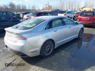 2014 Lincoln MKZ z VIN 3LN6L2J95ER830342, wystawiony jako IAAI lot #41876269 z przebiegiem 137 089 mil mil oraz . Historia ofert i sprzedaży dostępna na DreamBid. Obrazek 4.