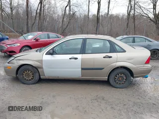 2003 Ford Focus LX with VIN 1FAFP33P33W267575, listed as a IAAI auction lot 41804406 with 106,957 mi miles and . Bid and sale history available at carsss.com. Image 14.