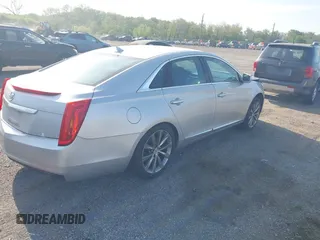 2013 Cadillac XTS with VIN 2G61N5S31D9135710, listed as a IAAI auction lot 42002480 with 162,029 mi miles. Bid and sale history available at carsss.com. Image 4.