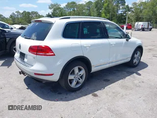 2012 Volkswagen Touareg Sport with VIN WVGEF9BP1CD008717, listed as a IAAI auction lot 42120641 with 211,580 mi miles and . Bid and sale history available at DreamBid. Image 4.
