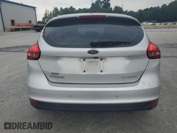 2017 Ford Focus Titanium with VIN 1FADP3N27HL251297, listed as a Copart auction lot 67373094 with 104,733 mi miles and Salvage Title. Bid and sale history available at carsss.com. Image 6.