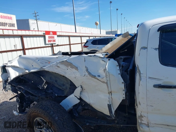 2013 Toyota Tacoma PreRunner with VIN 3TMKU4HN8DM038566, listed as a IAAI auction lot 41296386 with 153,240 mi miles and . Bid and sale history available at DreamBid. Image 18.