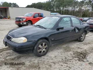 1998 Mercury Mystique z VIN 1MEFM66L7WK639796, wystawiony jako Copart lot #52880105 z przebiegiem 254 649 mil mil oraz Nie do naprawy. Historia ofert i sprzedaży dostępna na DreamBid. Obrazek 1.