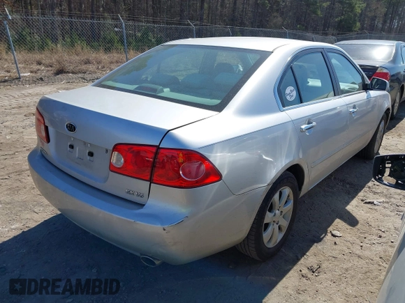 2007 Kia Optima EX with VIN KNAGE124975157963, listed as a IAAI auction lot 41673886 with 128,278 mi miles. Bid and sale history available at carsss.com. Image 4.