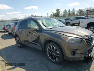 2016 Mazda CX-5 Grand Touring with VIN JM3KE4DY1G0806674, listed as a Copart auction lot 50549465 with 139,753 mi miles and Salvage Title. Bid and sale history available at carsss.com. Image 11.