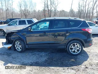 2014 Ford Escape Titanium with VIN 1FMCU9JX2EUA96338, listed as a IAAI auction lot 41806850 with 127,745 mi miles. Bid and sale history available at carsss.com. Image 14.