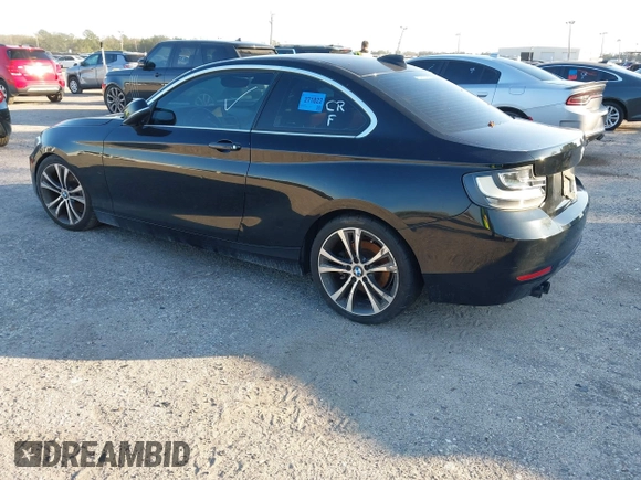 2015 BMW 2 Series 228i with VIN WBA1F5C58FV257021, listed as a IAAI auction lot 41318026 with 154,906 mi miles. Bid and sale history available at carsss.com. Image 3.