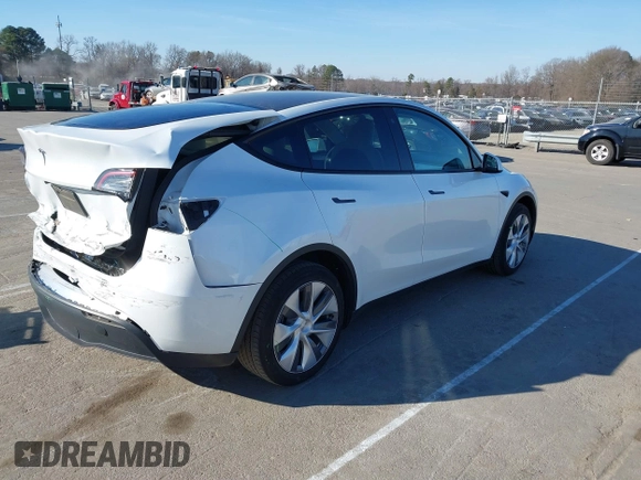 2023 Tesla Model Y Long Range with VIN 7SAYGDEE5PA094253, listed as a IAAI auction lot 41701966 with 29,458 mi miles and . Bid and sale history available at DreamBid. Image 4.