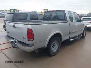 2003 Ford F-150 XL with VIN 2FTRX17223CA73626, listed as a IAAI auction lot 42027926 with 127,614 mi miles. Bid and sale history available at carsss.com. Image 4.