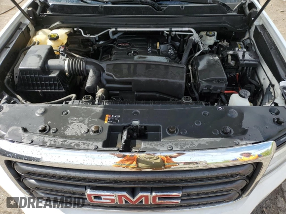 2015 GMC Canyon z VIN 1GTH6AEA7F1163952, wystawiony jako Copart lot #56680505 z przebiegiem 123 025 mil mil oraz Czysty tytuł • Clean title. Historia ofert i sprzedaży dostępna na DreamBid. Obrazek 11.