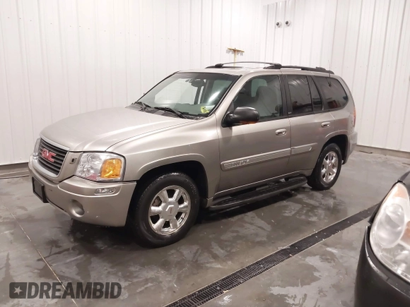 2003 GMC Envoy SLT with VIN 1GKDT13S932395367, listed as a IAAI auction lot 41544810 with 142,012 mi miles. Bid and sale history available at carsss.com. Image 16.