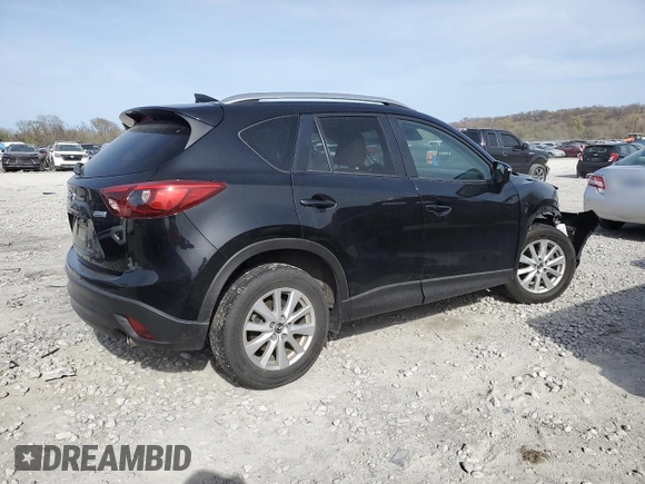 2016 Mazda CX-5 Touring z VIN JM3KE4CY0G0667171, wystawiony jako Copart lot #51579005 z przebiegiem 39 487 mil mil oraz Szkoda całkowita • Salvage title. Historia ofert i sprzedaży dostępna na DreamBid. Obrazek 3.